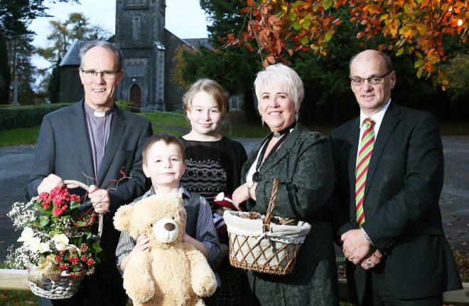 Preparing for the Festival of 175 Christmas Trees at Rossorry Parish Church are(from left); Canon Dr. Ian Ellis, rector; Alfie Graham, Katie Graham, Heather Ellis and David Morrison, Manager of the Killyhevlin Lakeside Hotel and Chalets, sponsors of the Festival. 