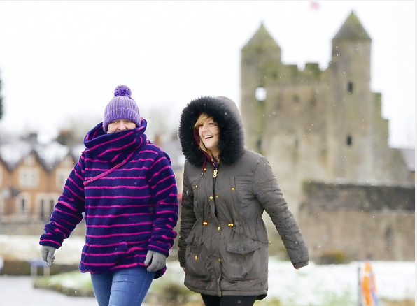 KEEPING WARM... Phyllis McGrath and Siobhan McGirr take a brisk stroll on their lunch break from BT Enniskillen during a chilly spell in Enniskillen last year RMG09