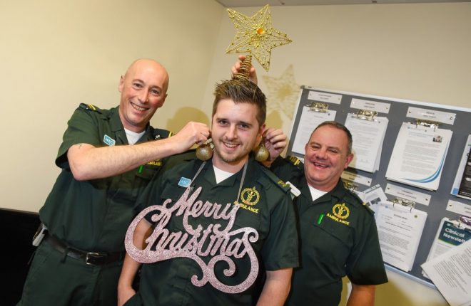 Paul Roycroft (Rapid Resonse Paramedic) and Malachy Love (Clinical Support Officer) get into the Christmas Spirit as they decorate their colleague Paddy Glass      
