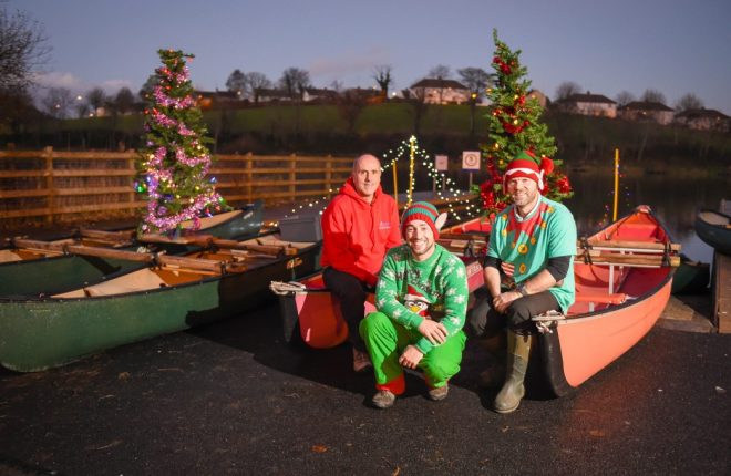 ALL SET...Mark Rogers, Marcus Mundy and Gordon Thompson of Erne Padders get ready to paddle their festive canoes around the island of Enniskillen, setting off from the Round O 