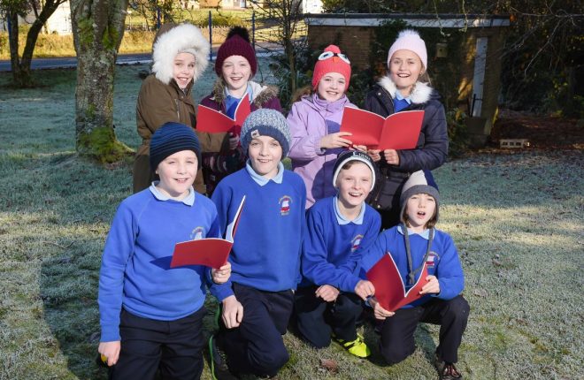 Singing Christmas carols at St Columban’s Primary School, Belcoo are, back from left, Scarlet O’Connor, Siofra McAloon, Eve Barrett and Abbie McGovern.  Front, Patrick Magee, Thomas Parker, Michael Burns and Liam Maguire        RMG61