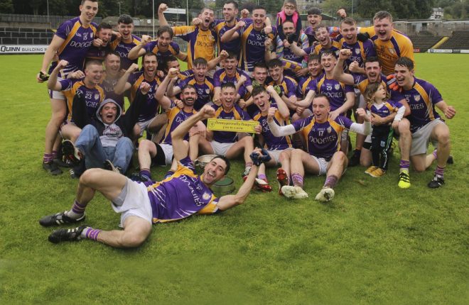 Derrygonnelly celebrate clinching their fifth successive county title.
