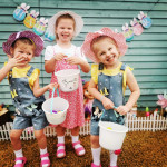 Lilija, Alexis and Sofija collecting eggs the Easter bunny left in there garden