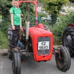 Checking the tyres on this tractor is young Ryan Kearns.