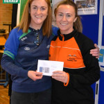 Nuala Maguire, winners of the Rock Runners Ladies 10k received her prize from Runners Chairperson Cathy McCaffrey.