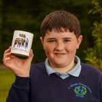 Pictured with the Tumbling Paddies mug is pupil Lewis Connolly