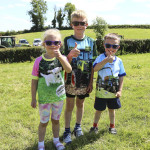 Thumbs Up - Niamh, Cahir and Caolan Grue give a big seal of approval to the tractor run