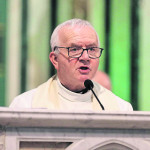 Canon Jimmy McPhillips says the opening prayer at the Blessing mass for St Kevin's College students heading to Kitui