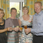 Joan Wiggins, Sandra, Stephanie and Stephen Richmond toast the schools 50 years. SH14