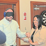 Michael Heany is lead away by orqaniser Teresa Rooney for Round 2 in the compeittiion