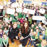 Sarah McCausland and Naoimhin Daly are ready for Croke Park supported by students from St Paul's Primary School, Irvinestown. RMGFH23