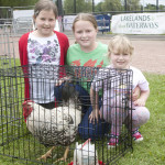 Linda, Becca and Megan Thompson from Letterbreen admiring a silver laced Wyandotte at the poultry display bmcb 26