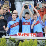 Ronan McHugh, Rian McGovern and Michael Glynn celebrate with the Hoagan Cup