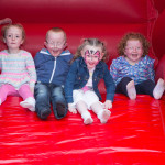 Niall and Katie McCarron with friends having a fun time on the slide provided by Jay Bees Castles JPM6443