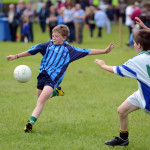 SCORE.. Emmett McGuinness shoots for Belcoo as he comes under pressure from his opponents defence. RMGFH06