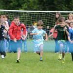RACE.. The competitors in the boys under nine sprint give it all the effort they can muster. RMGFH15